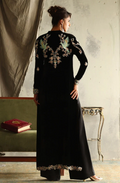 Back view of black velvet suit showing bird and floral embroidery across shoulders