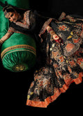 Model wearing black floral embroidered lehenga with scalloped gold blouse against plain backdrop - Èlaan Studio designer party wear