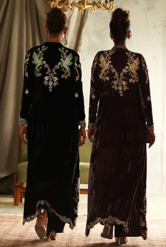 Back view of black velvet suit showing bird and floral embroidery across shoulders